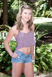 18 year old blonde teen April Aniston shows her small tits in backyard