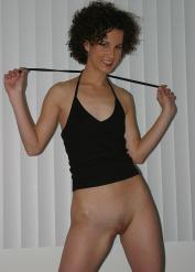 Amateur girl Karolina sports curly hair while fingers spreading her snatch