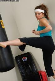 American MILF kickboxer Cali Lakai unveils her big boobs and rubs her cunt