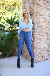Blonde babe Amber Alena exposes her massive juggs and gets banged on the floor