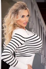 Blonde bombshell Katy Ann sets her fake tits free before baring her hot ass