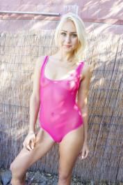 Blonde Natasha Voya takes her sheer bodysuit off & displays her hot pussy