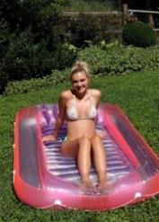 Blonde teen Molly Cooper takes off her bikini before pissing on a lawn
