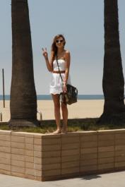 Brunette teen Alex Mae posing pantyless & flashing her tits on the sandy beach
