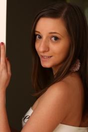 Brunette teen Ria Hill presents her twat and small tits before toying her ass