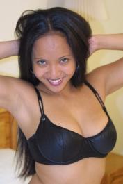 Busty Asian MILF Loni showing off her incredible sex skills in a hotel room