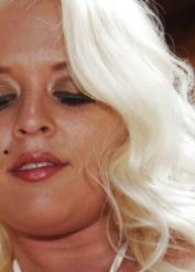Chubby blonde on high heels Angel Vain slowly uncovering her rubenesque curves