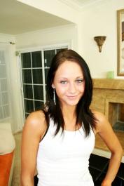 Dark haired teen model Jessica Valentino shows her tiny tits and blows a dong