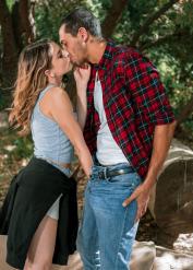 Hot blonde Kristen Scott poses solo near a brook before sex with a BBC
