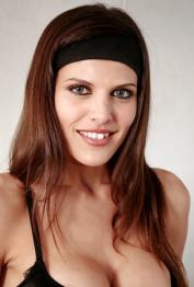 Latina vixen in lingerie Lola Del Valle stripping and caressing herself