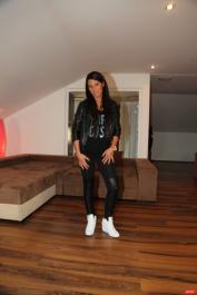 Little brunette Maria Fiori posing in her cute black outfit in a solo