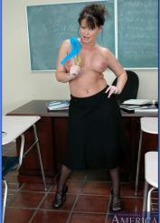 Mature sex teacher in stockings Maya Divine flaunting topless in class