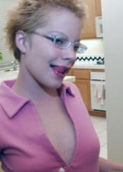 MILF redhead Emily Davinci does kitchen strip & smears chocolate on tiny tits