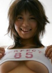 Seductive asian babe Azumi Harusaki posing in pink shorts and tiny top