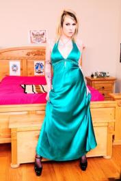Solo model Envy Vicious ditches a long gown to pose nude in garters and nylons