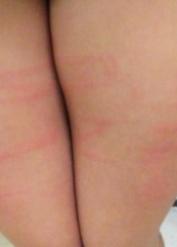 Solo model Jasmine Jade sports welts across her bare ass and thighs
