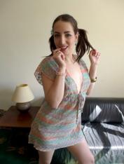 Tattooed brunette Liz Rainbow stands naked and ready for porn debut