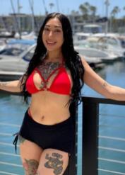 Tattooed brunette Wednesday Nyte eats ass while giving a blowjob