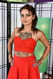 Tattooed chick Genevieve Sinn parts her trimmed bush with painted fingernails
