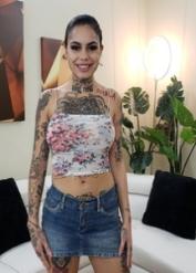 Tattooed hottie Genevieve Sinn presents her big tits and gives head