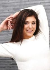 Teen babe Leah Gotti poses clothed in jeans before baring phat ass and tits