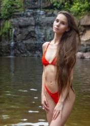 Teen Leona Mia doffs her bikini to show every inch of her slim body outdoors